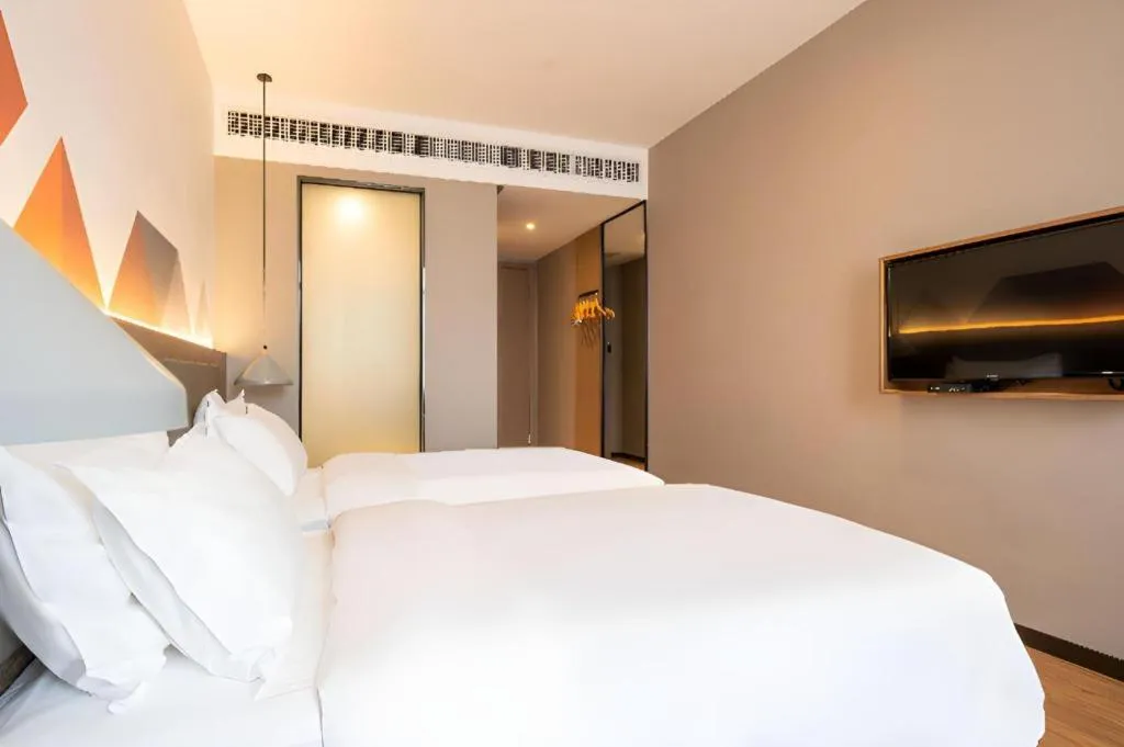 Bed in Borrman Hotel Zhonghsan Guzheng Huayi Plaza Light Rail Station