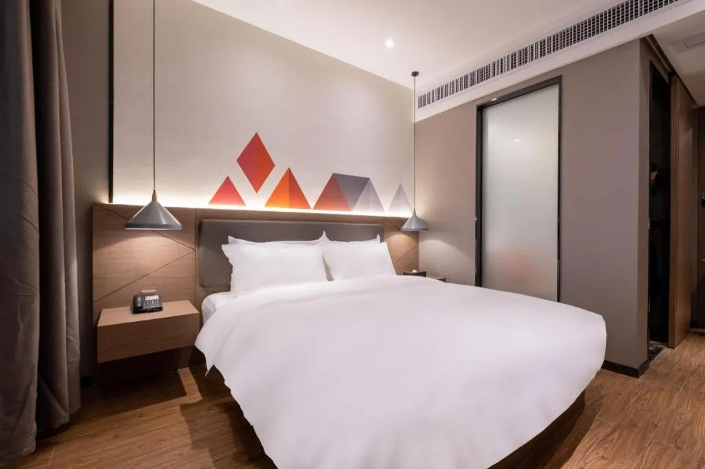 Bed in Borrman Hotel Zhonghsan Guzheng Huayi Plaza Light Rail Station