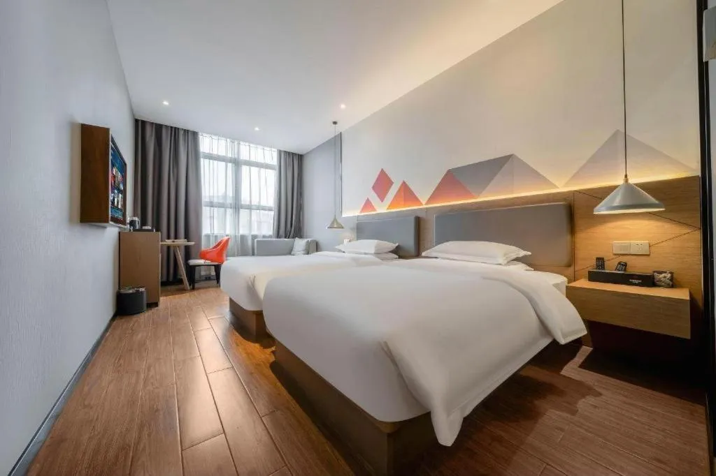 Bed in Borrman Hotel Zhonghsan Guzheng Huayi Plaza Light Rail Station