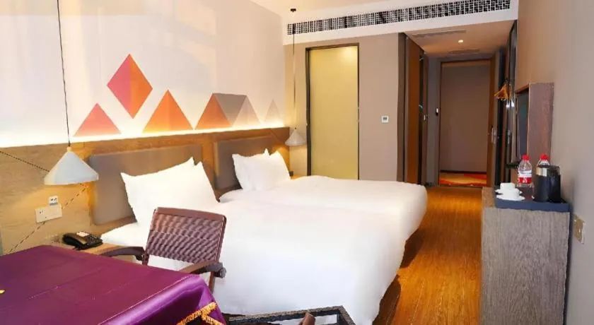 Bed in Borrman Hotel Zhonghsan Guzheng Huayi Plaza Light Rail Station