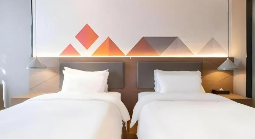 Bed in Borrman Hotel Zhonghsan Guzheng Huayi Plaza Light Rail Station