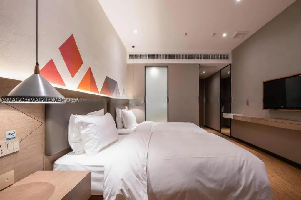 Bed in Borrman Hotel Zhonghsan Guzheng Huayi Plaza Light Rail Station