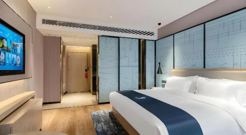 Bed in Echarm Hotel Suzhou Shengze Oriental Extile City