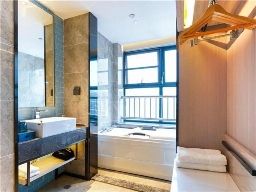 Bed in Echarm Hotel Suzhou Shengze Oriental Extile City