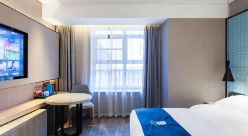 Bed in Echarm Hotel Suzhou Shengze Oriental Extile City