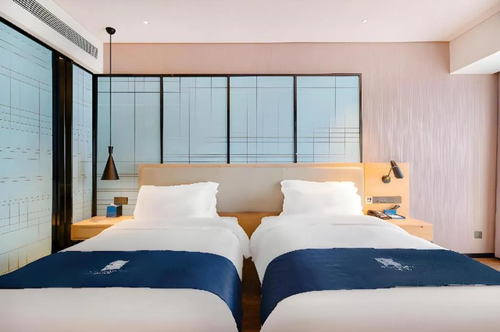 Bed in Echarm Hotel Suzhou Shengze Oriental Extile City