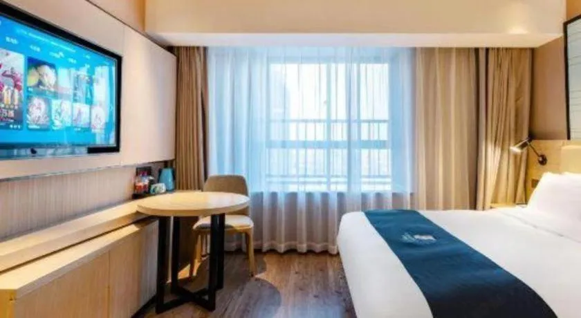 Bed in Echarm Hotel Suzhou Shengze Oriental Extile City