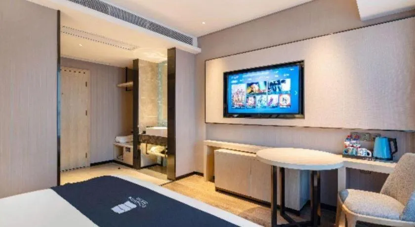 Bed in Echarm Hotel Suzhou Shengze Oriental Extile City