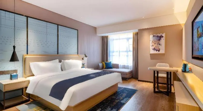 Bed in Echarm Hotel Suzhou Shengze Oriental Extile City