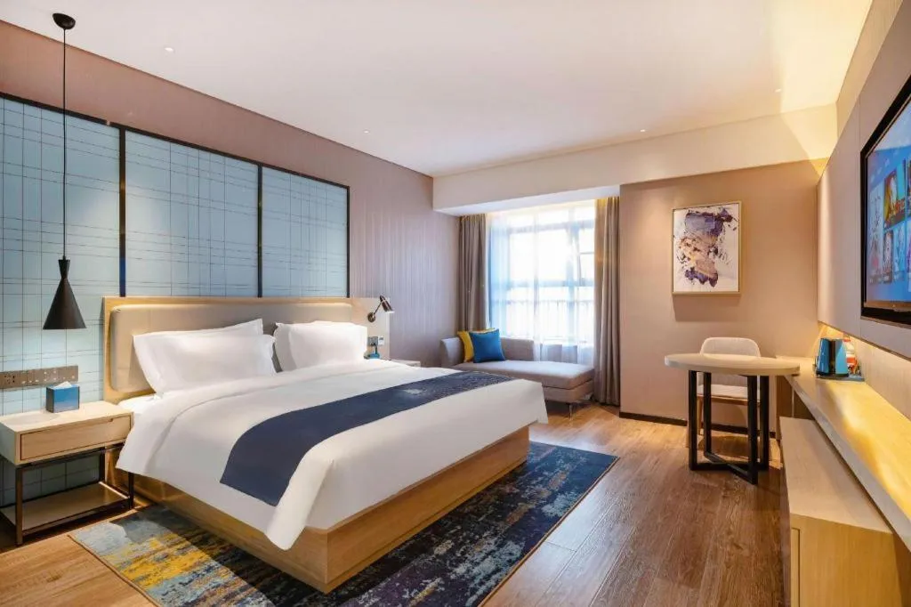 Bed in Echarm Hotel Suzhou Shengze Oriental Extile City