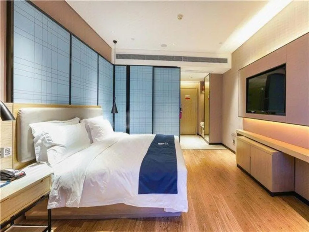 Bed in Echarm Hotel Suzhou Shengze Oriental Extile City