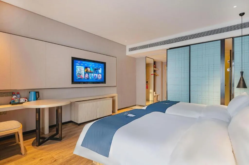 Bed in Echarm Hotel Suzhou Shengze Oriental Extile City