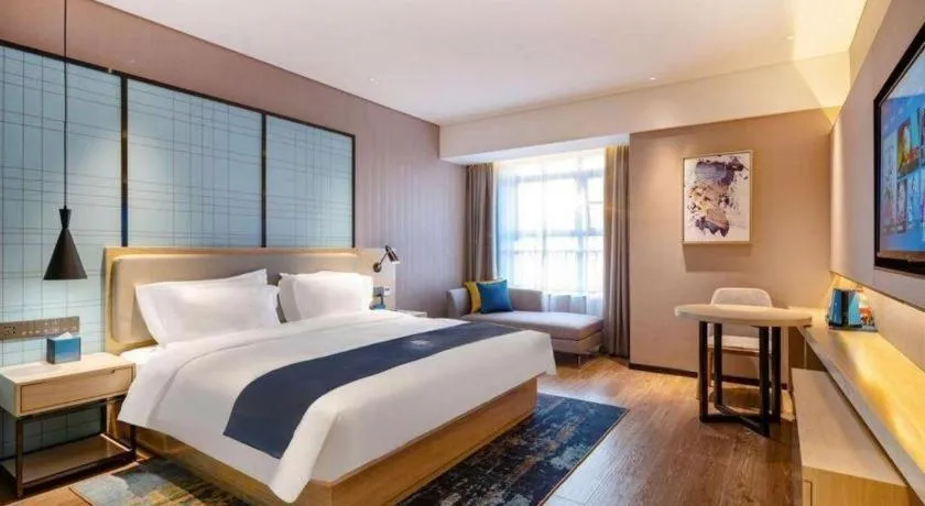 Bed in Echarm Hotel Suzhou Shengze Oriental Extile City