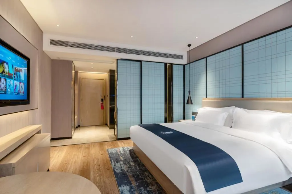 Bed in Echarm Hotel Suzhou Shengze Oriental Extile City