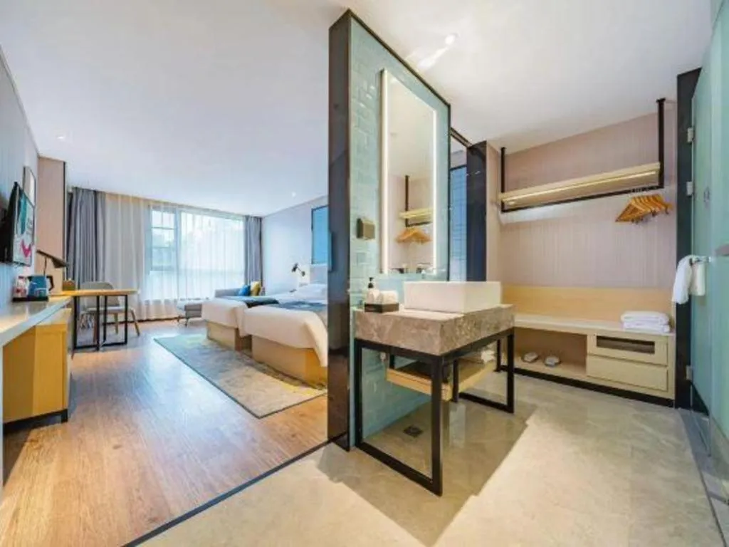 Bed in Echarm Hotel Suzhou Shengze Oriental Extile City