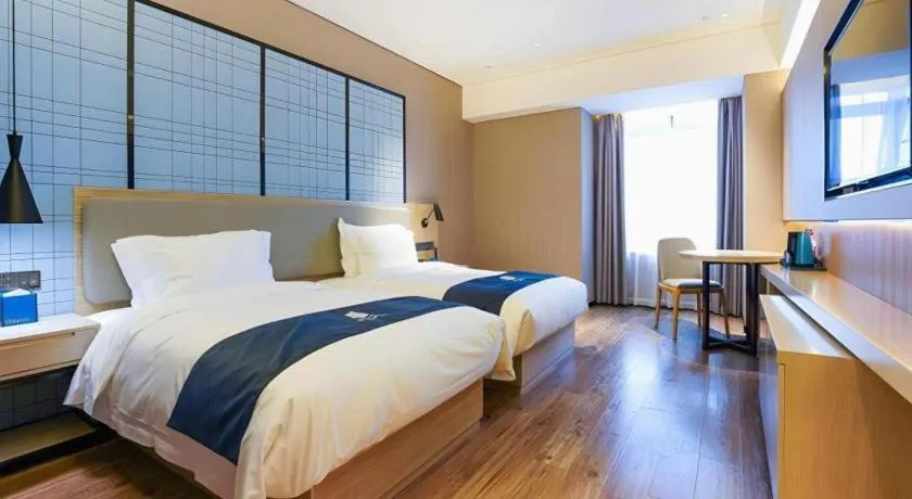 Bed in Echarm Hotel Suzhou Shengze Oriental Extile City