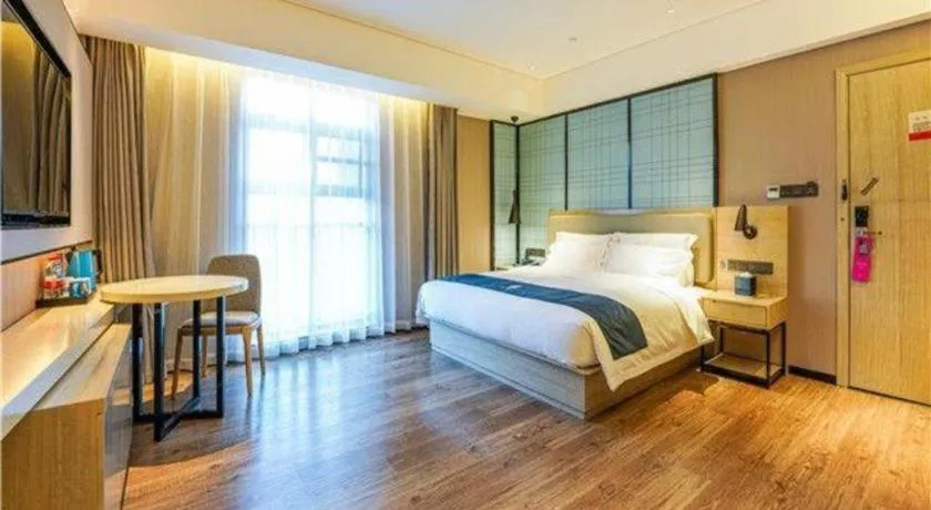 Bed in Echarm Hotel Suzhou Shengze Oriental Extile City