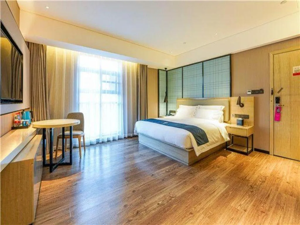 Bed in Echarm Hotel Suzhou Shengze Oriental Extile City