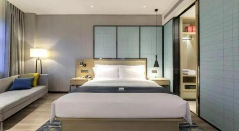 Bed in Echarm Hotel Suzhou Shengze Oriental Extile City