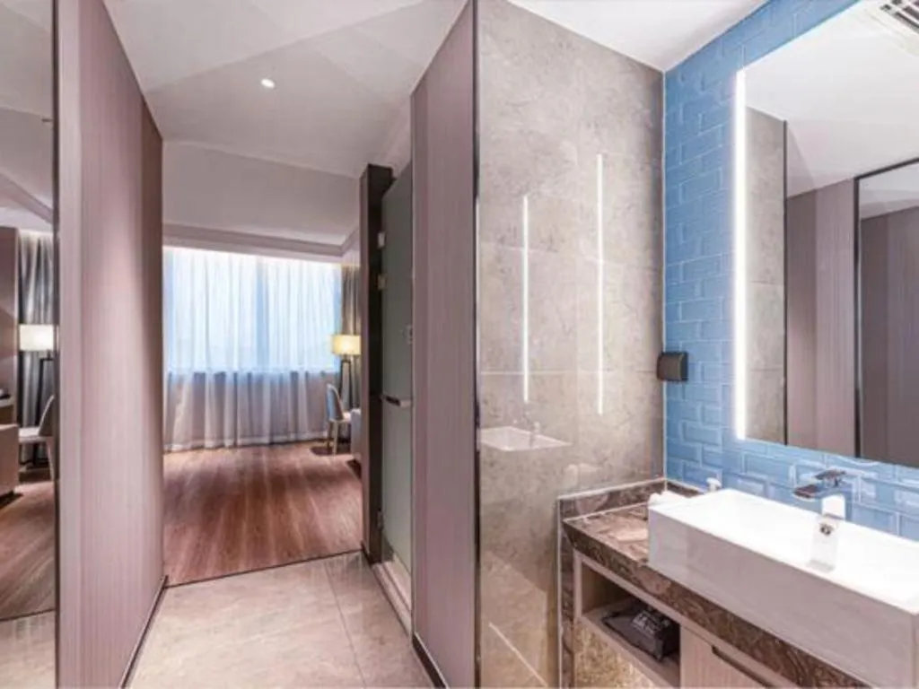 Bed in Echarm Hotel Suzhou Shengze Oriental Extile City