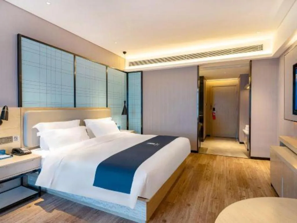 Bed in Echarm Hotel Suzhou Shengze Oriental Extile City