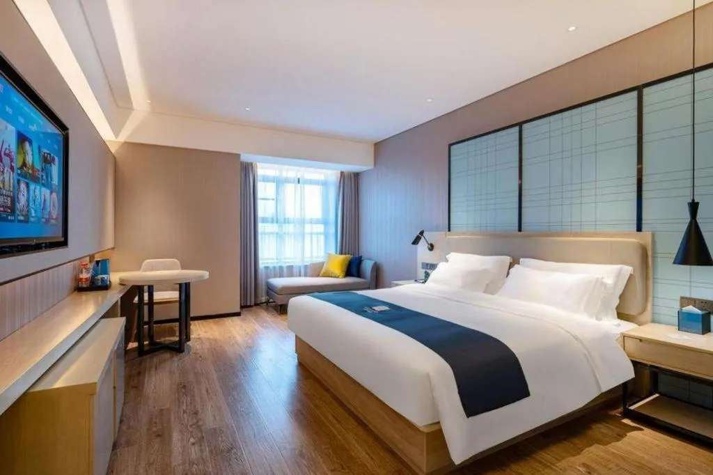 Bed in Echarm Hotel Suzhou Shengze Oriental Extile City