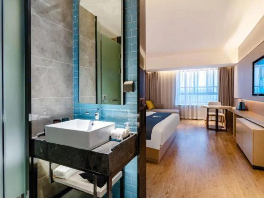 Bed in Echarm Hotel Suzhou Shengze Oriental Extile City