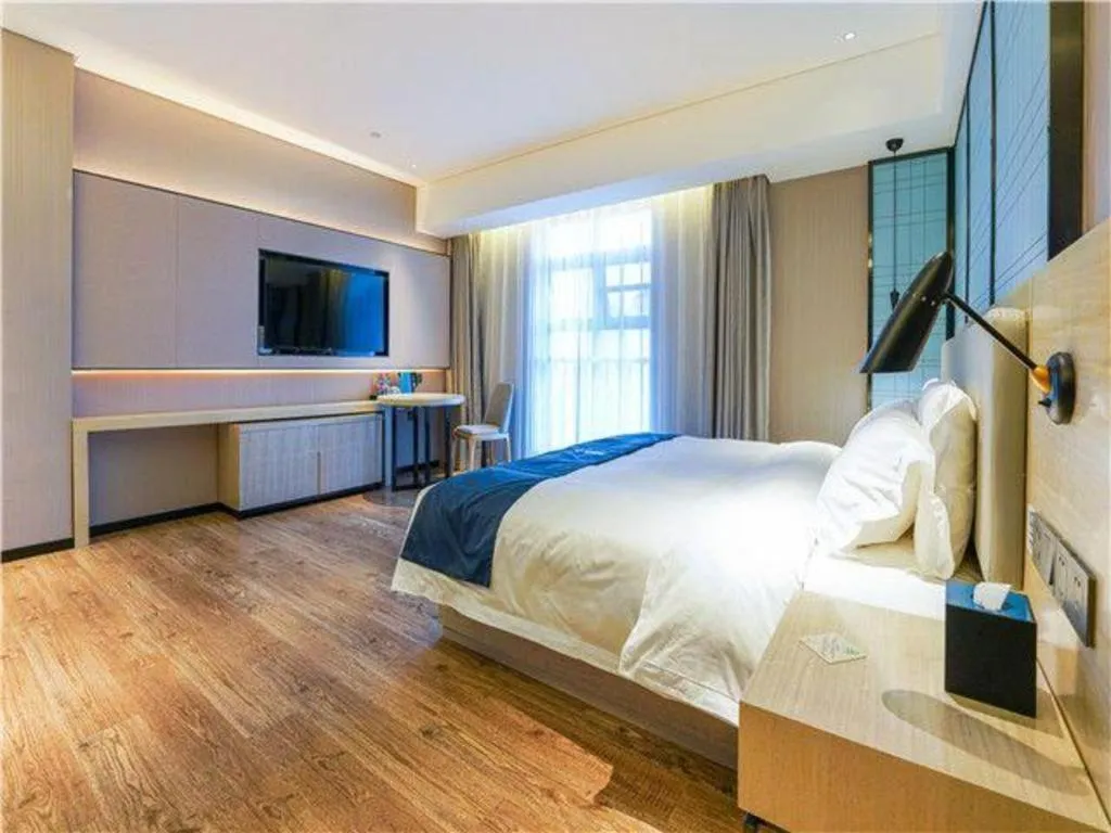 Bed in Echarm Hotel Suzhou Shengze Oriental Extile City