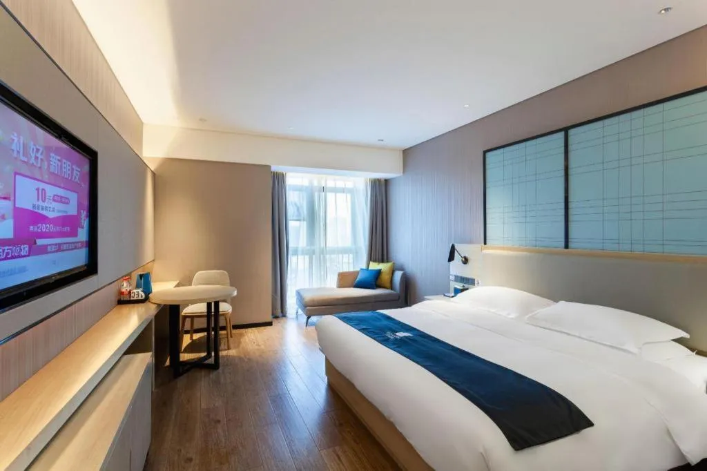 Bed in Echarm Hotel Suzhou Shengze Oriental Extile City