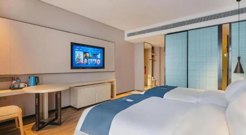 Bed in Echarm Hotel Suzhou Shengze Oriental Extile City