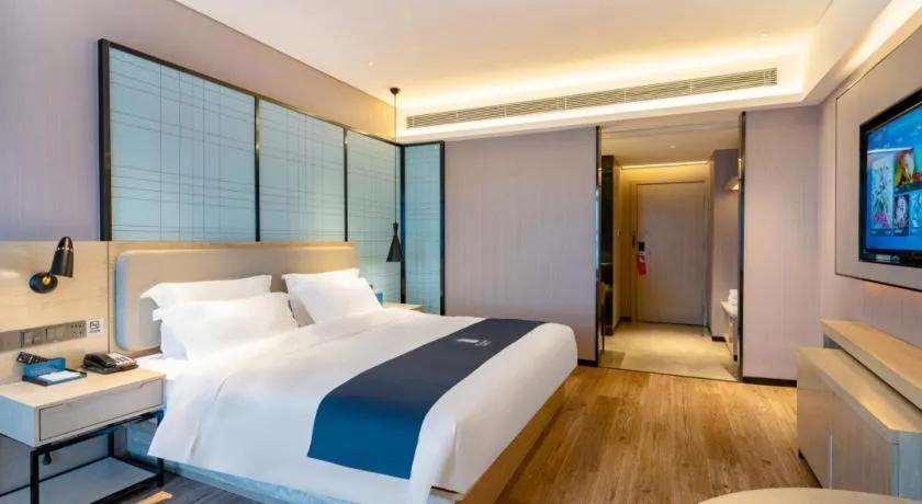 Bed in Echarm Hotel Suzhou Shengze Oriental Extile City