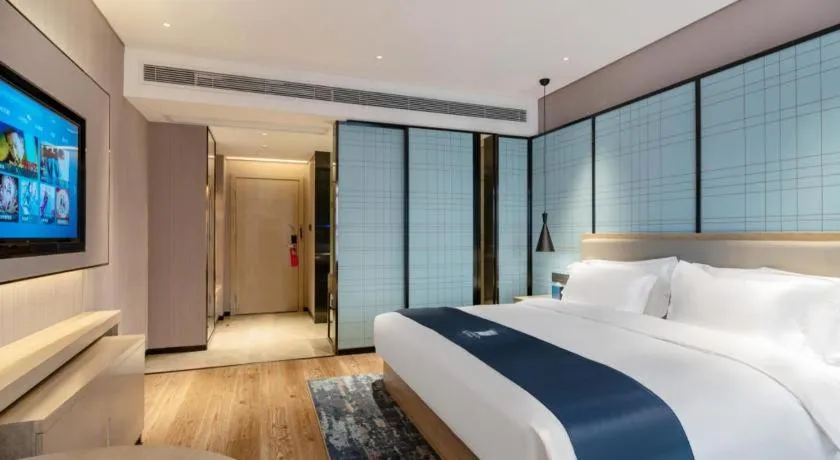 Bed in Echarm Hotel Suzhou Shengze Oriental Extile City
