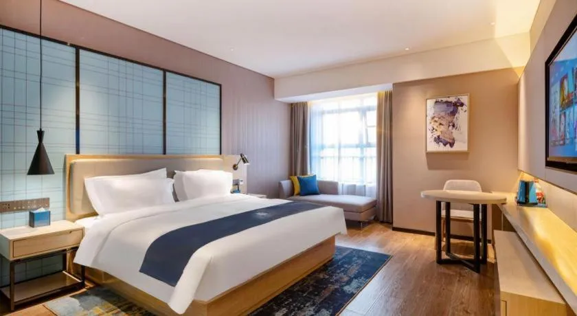Bed in Echarm Hotel Suzhou Shengze Oriental Extile City