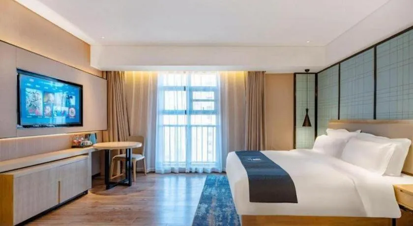 Bed in Echarm Hotel Suzhou Shengze Oriental Extile City