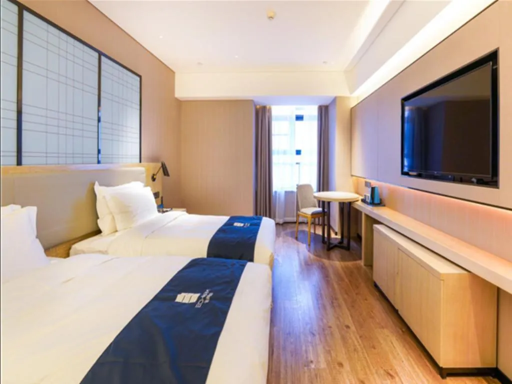 Bed in Echarm Hotel Suzhou Shengze Oriental Extile City