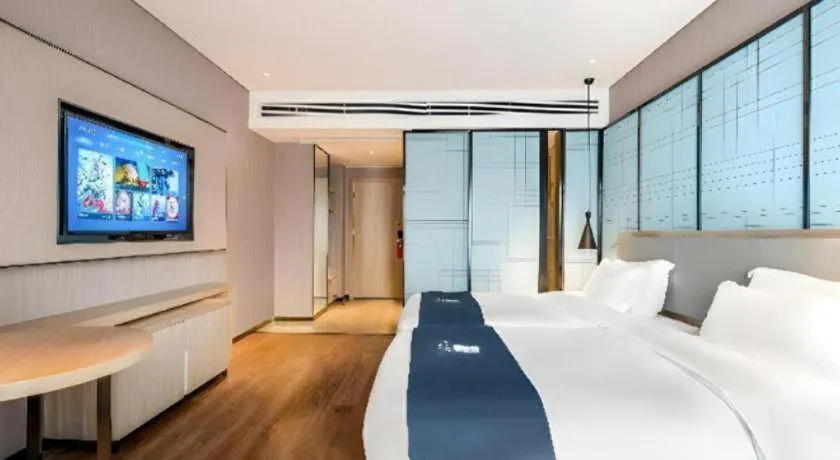 Bed in Echarm Hotel Suzhou Shengze Oriental Extile City