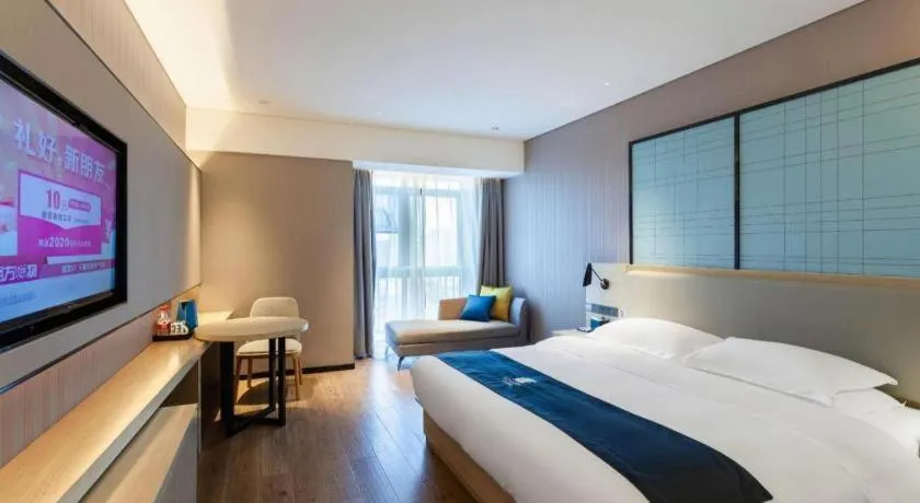 Bed in Echarm Hotel Suzhou Shengze Oriental Extile City