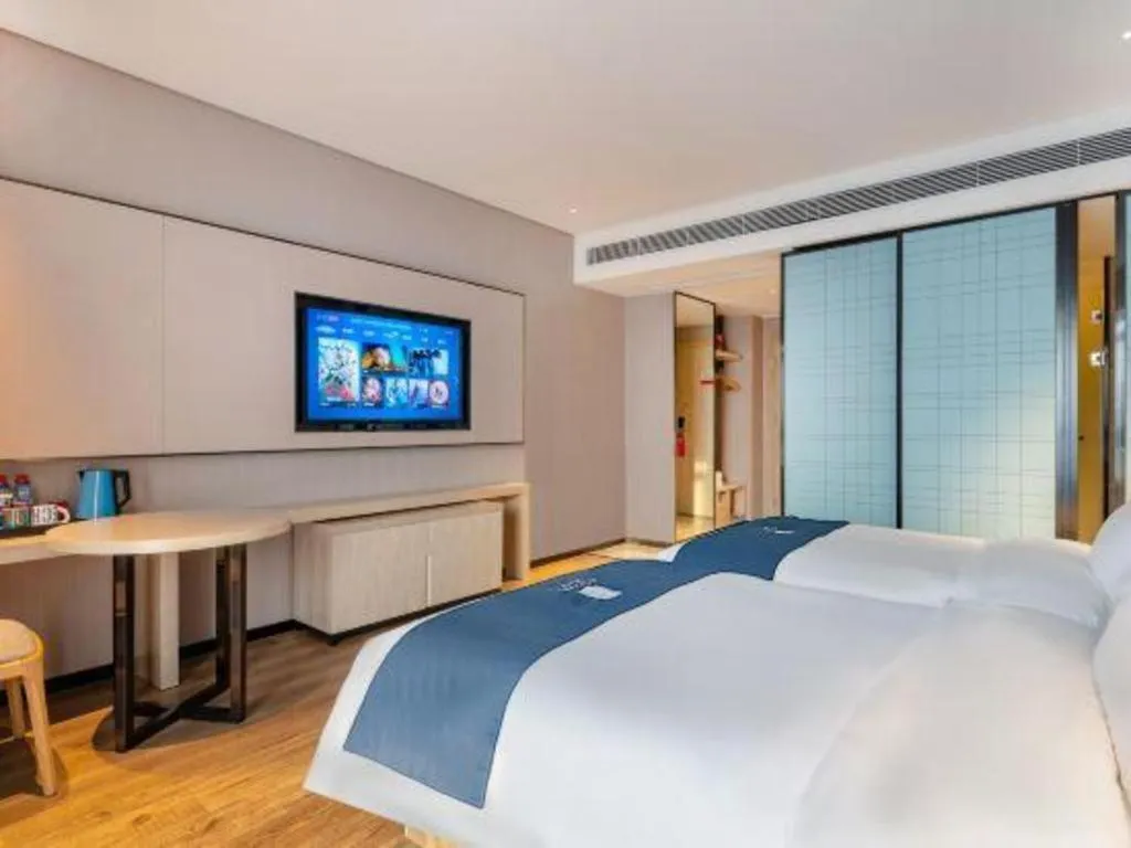 Bed in Echarm Hotel Suzhou Shengze Oriental Extile City