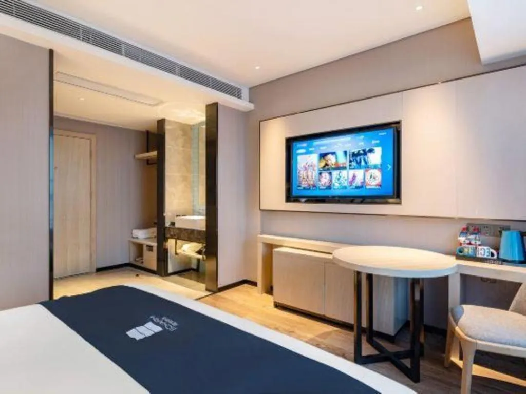 Bed in Echarm Hotel Suzhou Shengze Oriental Extile City