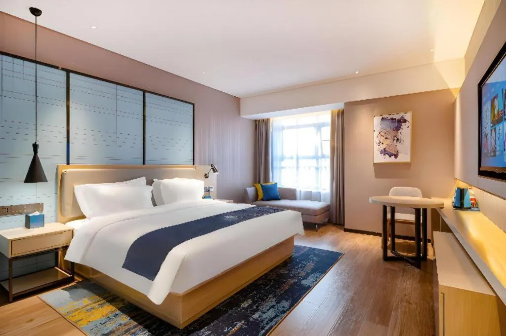 Bed in Echarm Hotel Suzhou Shengze Oriental Extile City