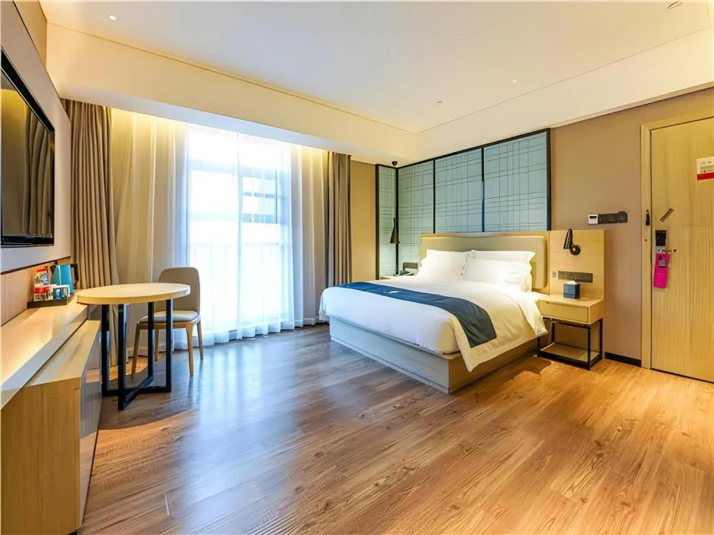 Bed in Echarm Hotel Suzhou Shengze Oriental Extile City