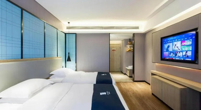 Bed in Echarm Hotel Suzhou Shengze Oriental Extile City