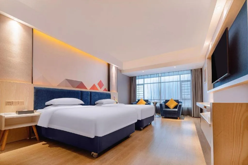 Bed in Borrman Hotel Liuzhou High-Speed Railway Station