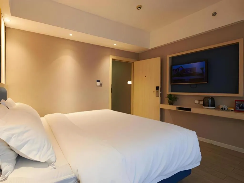 Bed in Borrman Hotel Liuzhou High-Speed Railway Station