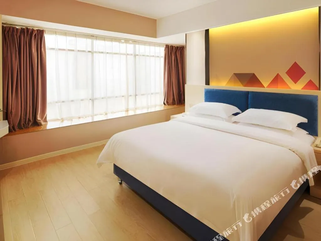 Bed in Borrman Hotel Liuzhou High-Speed Railway Station