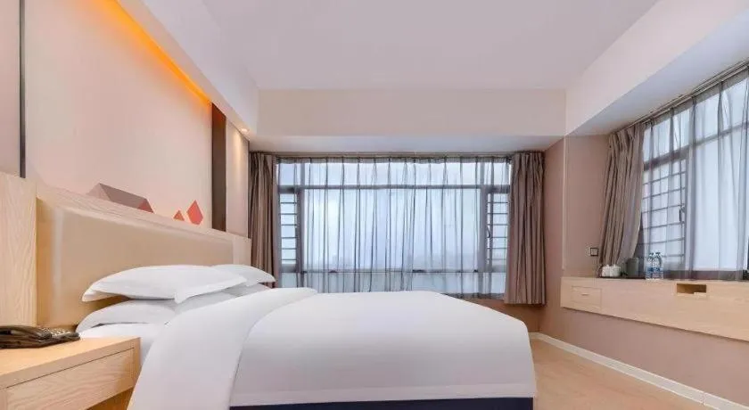 Bed in Borrman Hotel Liuzhou High-Speed Railway Station