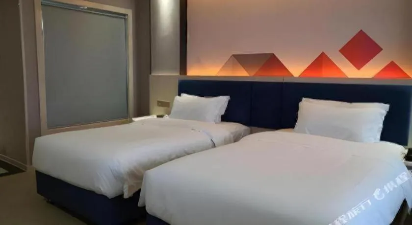 Bed in Borrman Hotel Liuzhou High-Speed Railway Station