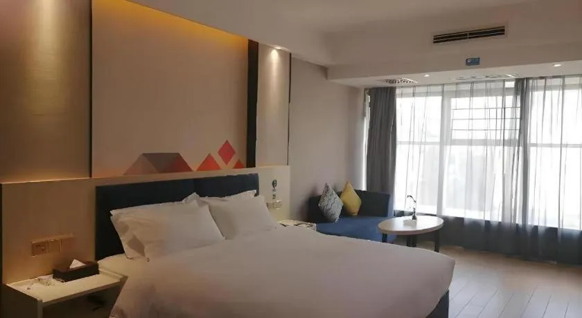 Bed in Borrman Hotel Liuzhou High-Speed Railway Station