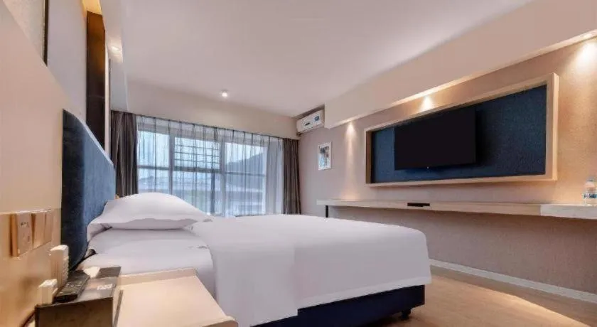 Bed in Borrman Hotel Liuzhou High-Speed Railway Station