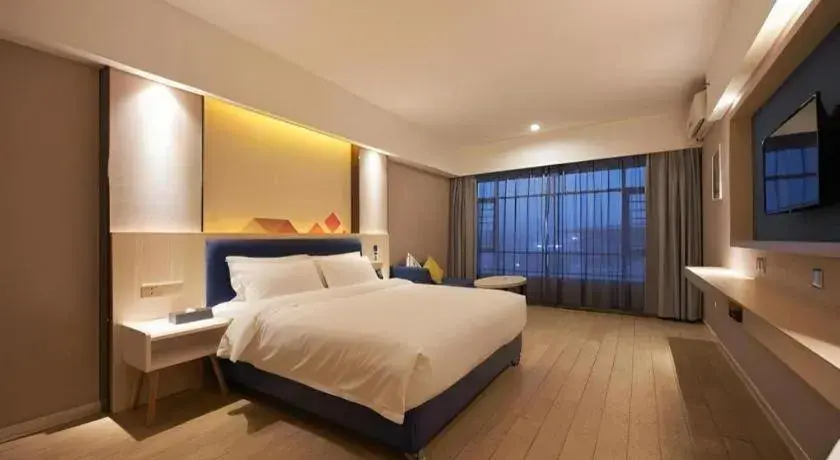 Bed in Borrman Hotel Liuzhou High-Speed Railway Station Bed in Borrman Hotel Liuzhou High-Speed Railway Station